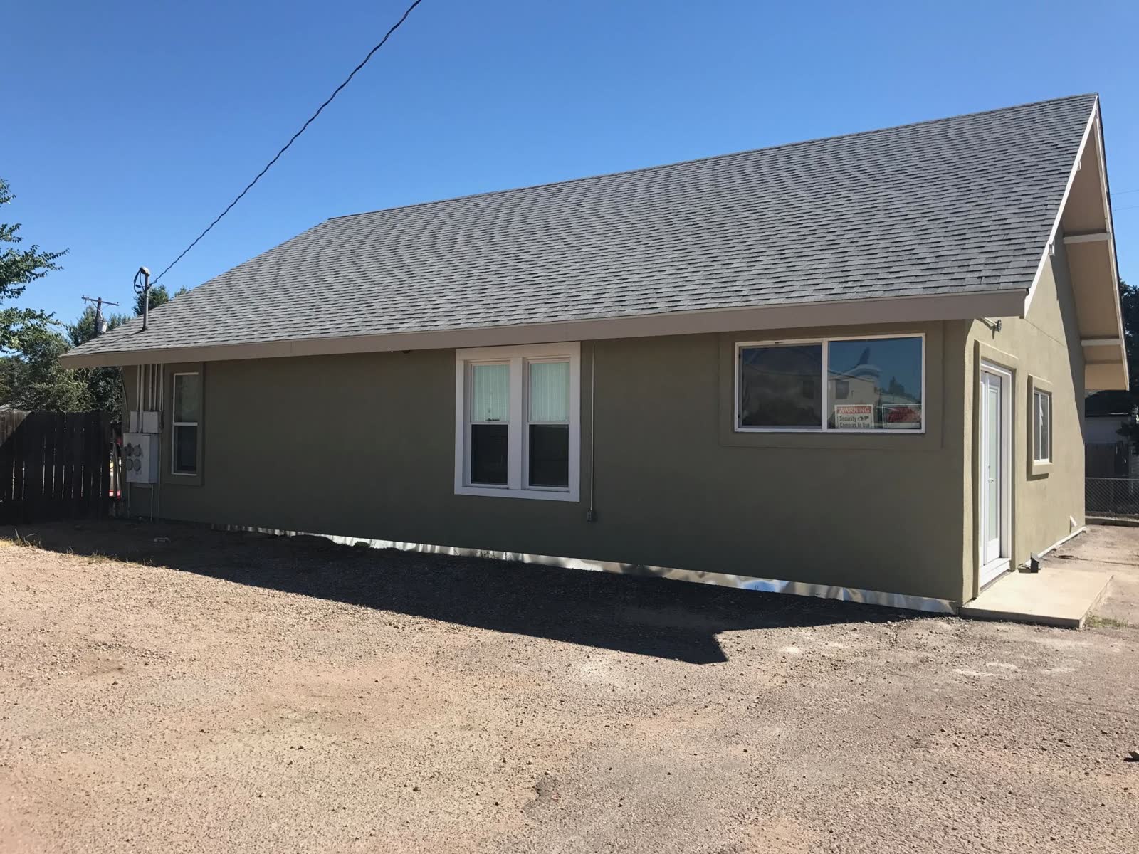 After: home refinished in a sage-green coating